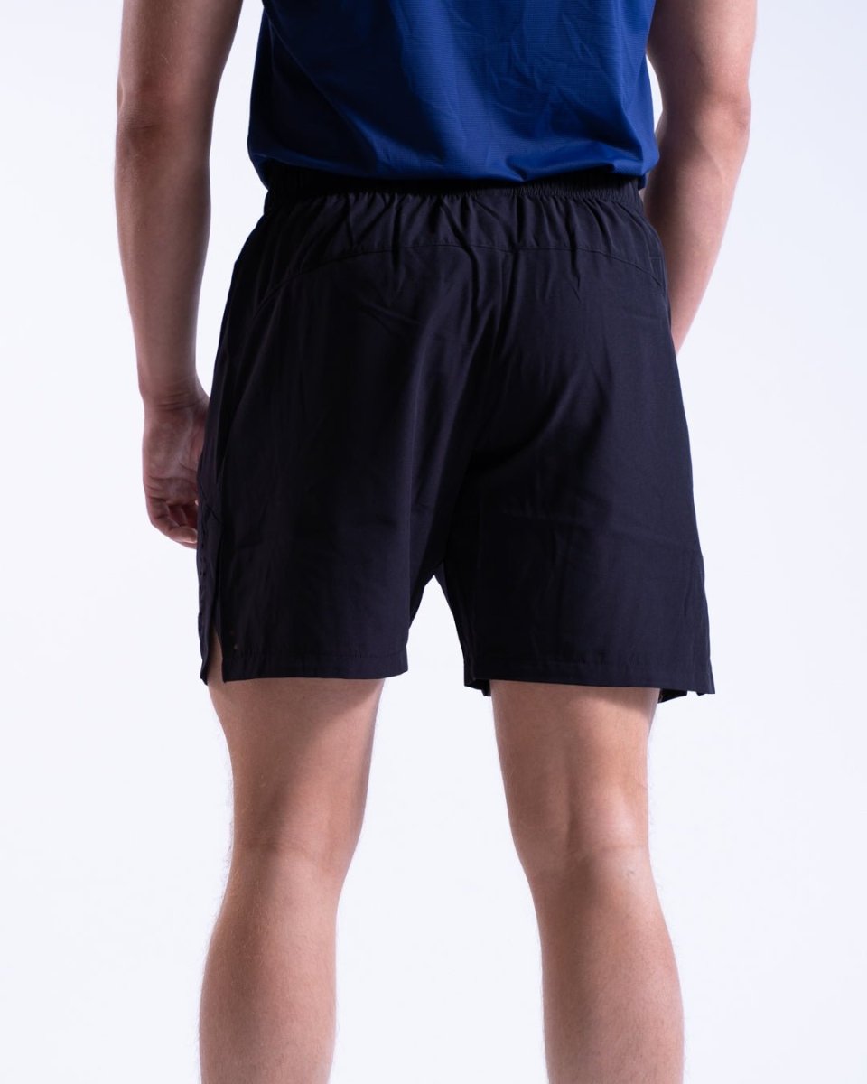 Side view of lightweight black men’s shorts, showcasing hand-in-pocket design for comfort - Black - The Lasting Shape